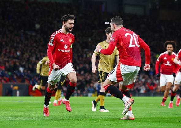 Bruno Fernandes of Manchester United, ManU celebrates scoring a goal from the penalty spot to make it 2-1 Manchester United v Real Sociedad, UEFA Europa League, Round of 16, Second Leg, Football, Old Trafford, Manchester, UK - 13 Mar 2025 EDITORIAL USE ONLY No use with unauthorised audio, video, data, fixture lists, club league logos or live services. Online in-match use limited to 120 images, no video emulation. No use in betting, games or single club league player publications. Copyright: xMattxWest Shutterstockx 15188208aq