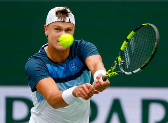 March 13, 2025 Holger Rune (DEN) returns a shot against Tallon Griekspoor (NED) during the 2025 BNP Paribas Open at Indian Wells Tennis Garden in Indian Wells, California. Mandatory Photo Credit: CSM Indian Wells United States of America - ZUMAc04_ 20250313_zma_c04_176 Copyright: xCharlesxBausx