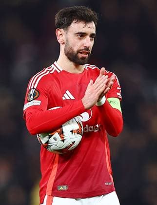Bruno Fernandes of Manchester United, ManU with the match ball at the end of the game Manchester United v Real Sociedad, UEFA Europa League, Round of 16, Second Leg, Football, Old Trafford, Manchester, UK - 13 Mar 2025 EDITORIAL USE ONLY No use with unauthorised audio, video, data, fixture lists, club league logos or live services. Online in-match use limited to 120 images, no video emulation. No use in betting, games or single club league player publications. Copyright: xMattxWest Shutterstockx 15188208aw
