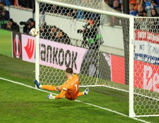 Jack Butland of Rangers saves the penalty from Dusan Tadic of Fenerbahce in the penalty shoot out during the UEFA Europa League round of 16 match at Ibrox Stadium, Glasgow. Rangers v Fenerbahce, UEFA Europa League, Round of 16, Second Leg, Football, Ibrox Stadium, Glasgow, Scotland, UK - 13 Mar 2025 EDITORIAL USE ONLY No use with unauthorised audio, video, data, fixture lists, club league logos or live services. Online in-match use limited to 120 images, no video emulation. No use in betting, games or single club league player publications. Copyright: xRangersxFC Shutterstockx 15196581i