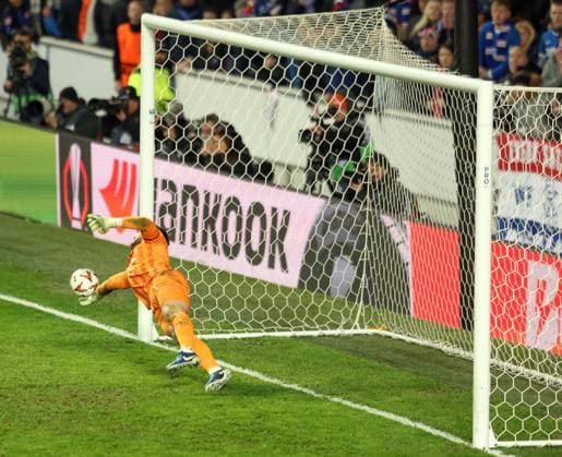 Jack Butland of Rangers saves a penalty from Fred of Fenerbahce in the penalty shootout during the UEFA Europa League round of 16 match at Ibrox Stadium, Glasgow. Rangers v Fenerbahce, UEFA Europa League, Round of 16, Second Leg, Football, Ibrox Stadium, Glasgow, Scotland, UK - 13 Mar 2025 EDITORIAL USE ONLY No use with unauthorised audio, video, data, fixture lists, club league logos or live services. Online in-match use limited to 120 images, no video emulation. No use in betting, games or single club league player publications. Copyright: xRangersxFC Shutterstockx 15196581u
