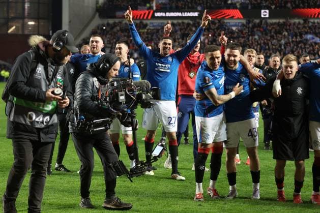 Leon Balogun of Rangers and his team mates celebrate after winning the penalty shoot out during the Europa League last 16 match at Ibrox Stadium, Glasgow. Rangers v Fenerbahce, UEFA Europa League, Round of 16, Second Leg, Football, Ibrox Stadium, Glasgow, Scotland, UK - 13 Mar 2025 EDITORIAL USE ONLY No use with unauthorised audio, video, data, fixture lists, club league logos or live services. Online in-match use limited to 120 images, no video emulation. No use in betting, games or single club league player publications. Copyright: xO Rourke RangersxFC Shutterstockx 15196580cp