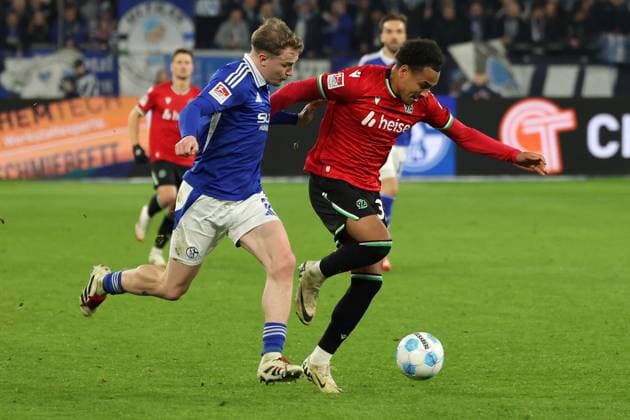 Soccer, 2 Bundesliga FC Schalke 04 Hannover 96, Matchday 26, Veltins Arena, Derry John Murkin FC Schalke 04 and Monju Thaddaus Momuluh Hannover 96 in a duel, DFB DFL REGULATIONS PROHIBIT ANY USE OF PHOTOGRAPHS AS IMAGE SEQUENCES AND OR QUASI VIDEO Copyright: JoachimxBywaletz xJB-Sportfoto