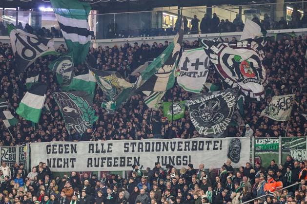 2 Bundesliga FC Schalke 04 Hannover 96 on 14 03 2025 at the Veltins Arena on Schalke The Hannover 96 fans wave flags in the guest block and present a banner Banner Against all stadium bans, dont give up boys MH