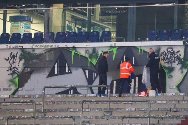 2 Bundesliga FC Schalke 04 Hannover 96 on 14 03 2025 at the Veltins Arena on Schalke The Hannover 96 fans have painted a graffiti in the guest block during the match, the police and stewards inspect the work after the final whistle MH