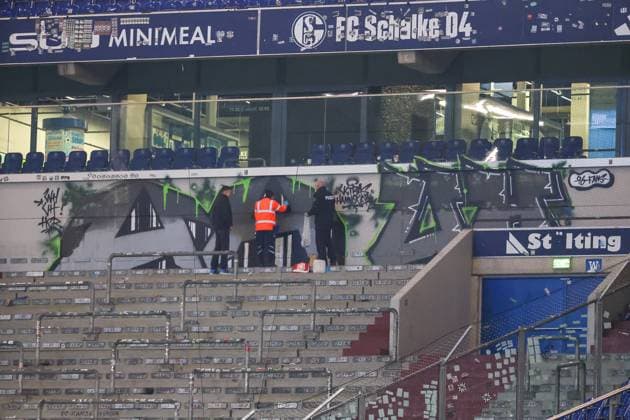 2 Bundesliga FC Schalke 04 Hannover 96 on 14 03 2025 at the Veltins Arena on Schalke The Hannover 96 fans have painted a graffiti in the guest block during the match, the police and stewards inspect the work after the final whistle MH
