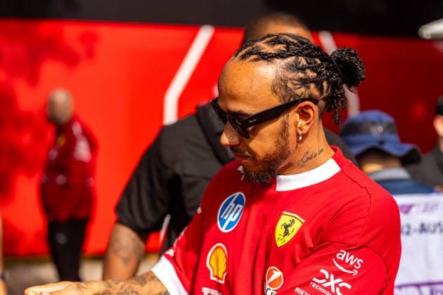 March 15, 2025, Melbourne, Victoria, Australia: Scuderia Ferrari HP driver LEWIS HAMILTON of the United Kingdom signs autographs in the paddock on Saturday at the Formula 1 Louis Vuitton Australian Grand Prix 2025 on March 15, 2025 in Melbourne, Australia. Melbourne Australia - ZUMAf186 20250315_zsp_f186_048 Copyright: xJamesxForresterx