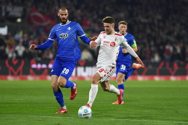 Aleksandar Vukotic SV Darmstadt 98 and Jan Thielmann 1 FC Koeln battle for the ball during the 2 Bundesliga match between 1 FC Köln and SV Darmstadt 98 at RheinEnergieStadion on March 15, 2025 in Cologne, Germany, Germany Photo by Ralf Treese DeFodi Images Aleksandar Vukotic SV Darmstadt 98 and Jan Thielmann 1 FC Koeln battle for the ball during the 2 Bundesliga match between 1 FC Köln and SV Darmstadt 98 at RheinEnergieStadion on March 15, 2025 in Cologne, Germany Photo by Ralf Treese DeFodi Images DFB DFL REGULATIONS PROHIBIT ANY USE OF PHOTOGRAPHS AS IMAGE SEQUENCES AND OR QUASI VIDEO Photo by Ralf Treese DeFodi Images