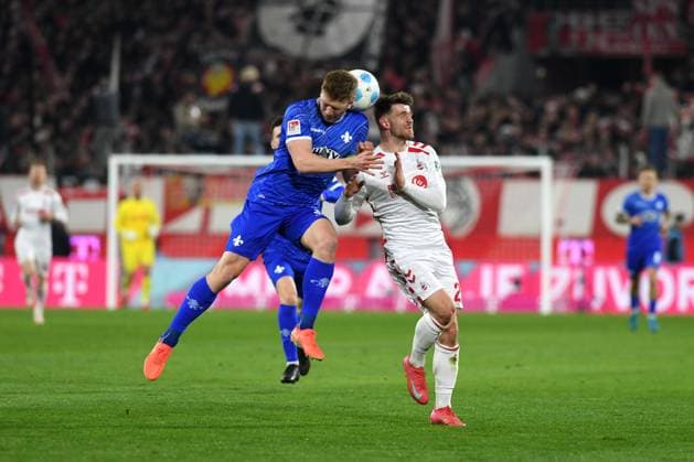 Clemens Riedel SV Darmstadt 98 and Jan Thielmann 1 FC Koeln battle for the ball during the 2 Bundesliga match between 1 FC Köln and SV Darmstadt 98 at RheinEnergieStadion on March 15, 2025 in Cologne, Germany, Germany Photo by Ralf Treese DeFodi Images Clemens Riedel SV Darmstadt 98 and Jan Thielmann 1 FC Koeln battle for the ball during the 2 Bundesliga match between 1 FC Köln and SV Darmstadt 98 at RheinEnergieStadion on March 15, 2025 in Cologne, Germany Photo by Ralf Treese DeFodi Images DFB DFL REGULATIONS PROHIBIT ANY USE OF PHOTOGRAPHS AS IMAGE SEQUENCES AND OR QUASI VIDEO Photo by Ralf Treese DeFodi Images