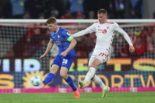 Clemens Riedel SV Darmstadt 98 and Steffen Tigges 1 FC Koeln battle for the ball during the 2 Bundesliga match between 1 FC Köln and SV Darmstadt 98 at RheinEnergieStadion on March 15, 2025 in Cologne, Germany, Germany Photo by Oliver Kaelke DeFodi Images Clemens Riedel SV Darmstadt 98 and Steffen Tigges 1 FC Koeln battle for the ball during the 2 Bundesliga match between 1 FC Köln and SV Darmstadt 98 at RheinEnergieStadion on March 15, 2025 in Cologne, Germany Photo by Oliver Kaelke DeFodi Images DFB DFL REGULATIONS PROHIBIT ANY USE OF PHOTOGRAPHS AS IMAGE SEQUENCES AND OR QUASI VIDEO Photo by Oliver Kaelke DeFodi Images