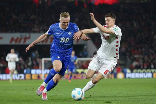 Isac Lidberg SV Darmstadt 98 and Eric Martel 1 FC Koeln battle for the ball during the 2 Bundesliga match between 1 FC Köln and SV Darmstadt 98 at RheinEnergieStadion on March 15, 2025 in Cologne, Germany, Germany Photo by Oliver Kaelke DeFodi Images Isac Lidberg SV Darmstadt 98 and Eric Martel 1 FC Koeln battle for the ball during the 2 Bundesliga match between 1 FC Köln and SV Darmstadt 98 at RheinEnergieStadion on March 15, 2025 in Cologne, Germany Photo by Oliver Kaelke DeFodi Images DFB DFL REGULATIONS PROHIBIT ANY USE OF PHOTOGRAPHS AS IMAGE SEQUENCES AND OR QUASI VIDEO Photo by Oliver Kaelke DeFodi Images