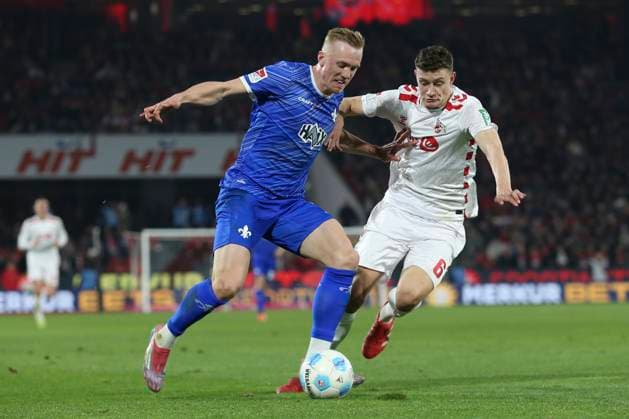Isac Lidberg SV Darmstadt 98 and Eric Martel 1 FC Koeln battle for the ball during the 2 Bundesliga match between 1 FC Köln and SV Darmstadt 98 at RheinEnergieStadion on March 15, 2025 in Cologne, Germany, Germany Photo by Oliver Kaelke DeFodi Images Isac Lidberg SV Darmstadt 98 and Eric Martel 1 FC Koeln battle for the ball during the 2 Bundesliga match between 1 FC Köln and SV Darmstadt 98 at RheinEnergieStadion on March 15, 2025 in Cologne, Germany Photo by Oliver Kaelke DeFodi Images DFB DFL REGULATIONS PROHIBIT ANY USE OF PHOTOGRAPHS AS IMAGE SEQUENCES AND OR QUASI VIDEO Photo by Oliver Kaelke DeFodi Images