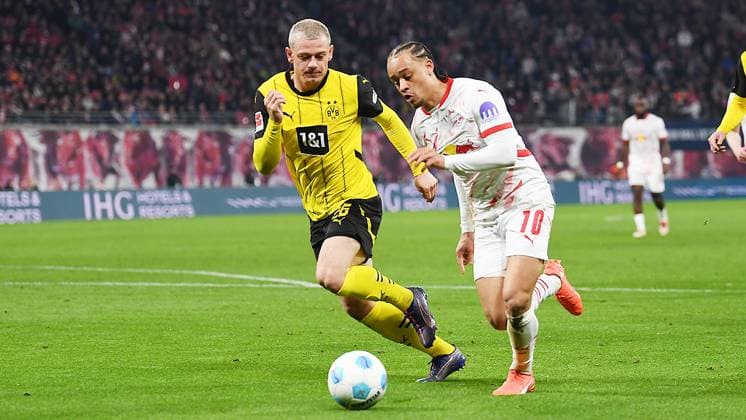 Soccer, 1 Bundesliga, Season 2024 2025, Matchday 26, RB Leipzig vs Borussia Dortmund 15 03 2025 Duel for the ball between Xavi Simons offensive midfield RB Leipzig, back number 10 right and Julian Ryerson defense Borussia Dortmund, back number 26 left at the match RB Leipzig vs Dortmund 15 03 2025 Leipzig Saxony Germany Red Bull Arena