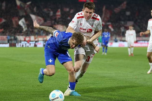 15 03 2025, xrekx, Soccer 2 Bundesliga, 1 FC Koeln SV Darmstadt 98 v l Luca Marseiler SV Darmstadt 98 Dominique Heintz 1 FC Koeln Zweikampf, Aktion, action, battle for the ball DFL DFB REGULATIONS PROHIBIT ANY USE OF PHOTOGRAPHS as IMAGE SEQUENCES and or QUASI VIDEO Koeln
