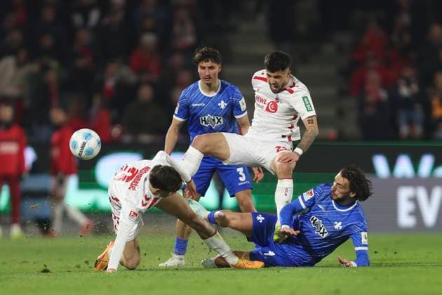 Denis Huseinbasic 1 FC Koeln , Jusuf Gazibegovic 1 FC Koeln and Fraser Hornby SV Darmstadt 98 battle for the ball during the 2 Bundesliga match between 1 FC Köln and SV Darmstadt 98 at RheinEnergieStadion on March 15, 2025 in Cologne, Germany Photo by Oliver Kaelke DeFodi Images Denis Huseinbasic 1 FC Koeln , Jusuf Gazibegovic 1 FC Koeln and Fraser Hornby SV Darmstadt 98 battle for the ball during the 2 Bundesliga match between 1 FC Köln and SV Darmstadt 98 at RheinEnergieStadion on March 15, 2025 in Cologne, Germany Photo by Oliver Kaelke DeFodi Images DFB DFL REGULATIONS PROHIBIT ANY USE OF PHOTOGRAPHS AS IMAGE SEQUENCES AND OR QUASI VIDEO Photo by Oliver Kaelke DeFodi Images