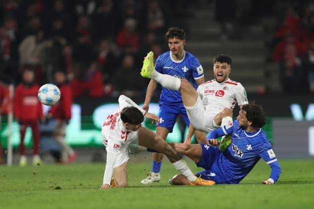 Denis Huseinbasic 1 FC Koeln , Jusuf Gazibegovic 1 FC Koeln and Fraser Hornby SV Darmstadt 98 battle for the ball during the 2 Bundesliga match between 1 FC Köln and SV Darmstadt 98 at RheinEnergieStadion on March 15, 2025 in Cologne, Germany Photo by Oliver Kaelke DeFodi Images Denis Huseinbasic 1 FC Koeln , Jusuf Gazibegovic 1 FC Koeln and Fraser Hornby SV Darmstadt 98 battle for the ball during the 2 Bundesliga match between 1 FC Köln and SV Darmstadt 98 at RheinEnergieStadion on March 15, 2025 in Cologne, Germany Photo by Oliver Kaelke DeFodi Images DFB DFL REGULATIONS PROHIBIT ANY USE OF PHOTOGRAPHS AS IMAGE SEQUENCES AND OR QUASI VIDEO Photo by Oliver Kaelke DeFodi Images