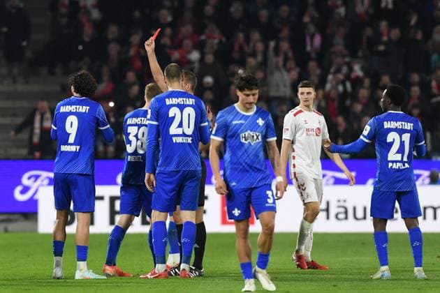 Referee Florian Heft shows the yellow red card to Fraser Hornby SV Darmstadt 98 during the 2 Bundesliga match between 1 FC Köln and SV Darmstadt 98 at RheinEnergieStadion on March 15, 2025 in Cologne, Germany, Germany Photo by Ralf Treese DeFodi Images Referee Florian Heft shows the yellow red card to Fraser Hornby SV Darmstadt 98 during the 2 Bundesliga match between 1 FC Köln and SV Darmstadt 98 at RheinEnergieStadion on March 15, 2025 in Cologne, Germany Photo by Ralf Treese DeFodi Images DFB DFL REGULATIONS PROHIBIT ANY USE OF PHOTOGRAPHS AS IMAGE SEQUENCES AND OR QUASI VIDEO Photo by Ralf Treese DeFodi Images