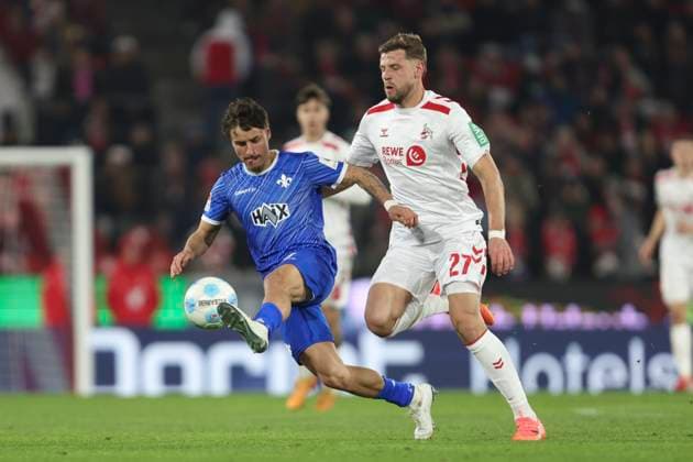 Guille Bueno SV Darmstadt 98 and Imad Rondic 1 FC Koeln battle for the ball during the 2 Bundesliga match between 1 FC Köln and SV Darmstadt 98 at RheinEnergieStadion on March 15, 2025 in Cologne, Germany, Germany Photo by Oliver Kaelke DeFodi Images Guille Bueno SV Darmstadt 98 and Imad Rondic 1 FC Koeln battle for the ball during the 2 Bundesliga match between 1 FC Köln and SV Darmstadt 98 at RheinEnergieStadion on March 15, 2025 in Cologne, Germany Photo by Oliver Kaelke DeFodi Images DFB DFL REGULATIONS PROHIBIT ANY USE OF PHOTOGRAPHS AS IMAGE SEQUENCES AND OR QUASI VIDEO Photo by Oliver Kaelke DeFodi Images