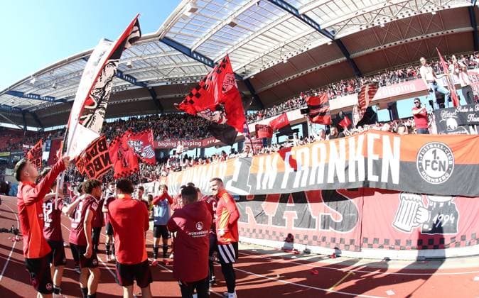 16 03 2025 Soccer Season 2024 2025 2 Soccer Bundesliga 26 Matchday 1 FC Nürnberg FCN Club SpVgg Greuther Fürth Kleeblatt Derby Frankenderby Sportfoto Zink DaMa xdaxmax DFL regulations prohibit any use of photographs as image sequences and or quasi video only for editorial use Jubel Freude nach Spielende Mannschaft Team des FCN celebrates with Clubfan Clubfans FCN Fans Fans in der Nordkurve