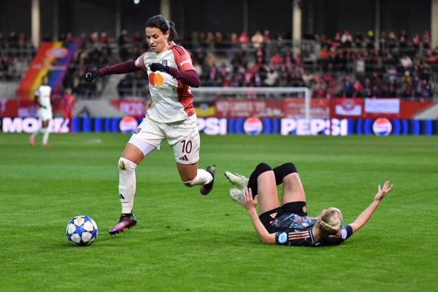 Giulia Gwinn 7 FC Bayern and Dzsenifer Marozsan 10 Olympique Lyonnais in action at the UEFA Womens Champions League match FC Bayern Munich Olympique Lyon on 18 03 2025 Munich FC Bayern Campus Bayern Germany