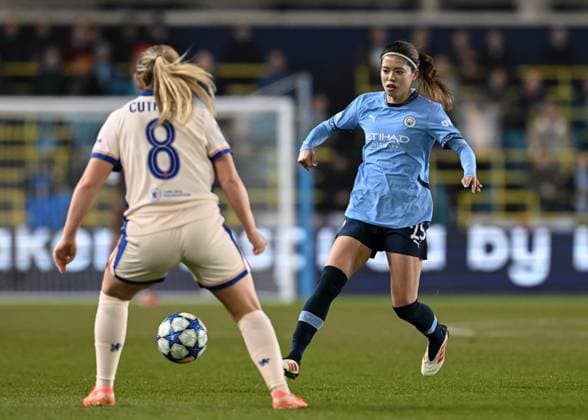 Manchester, England, 19th March 2025. Yui Hasegawa of Manchester City passes the ball during the UEFA Womens Champions League match at the Academy Stadium, Manchester. Picture credit should read: Cody Froggatt Sportimage EDITORIAL USE ONLY. No use with unauthorised audio, video, data, fixture lists, club league logos or live services. Online in-match use limited to 120 images, no video emulation. No use in betting, games or single club league player publications. SPI_019_CF_3760_MANCHESTER_CITY_WOMEN_V_CHELSEA_WOMEN_019 SPI-3760-0020