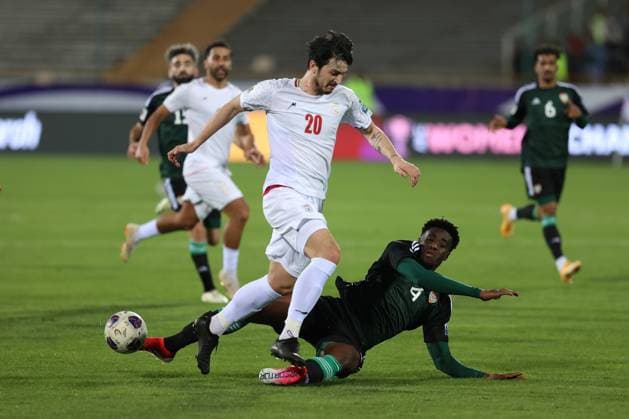 TEHRAN, IRAN - 20 March 2025 - Sardar Azmoun of Iran and Kouame Autonne of United Arab Emirates. during the FIFA World Cup, WM, Weltmeisterschaft, Fussball 2026 Qualification AFC, Group A round 7 match between Iran and UAE, United Arabic Emirates national football team at Azadi Stadium in Tehran, Iran Iran v UAE - FIFA World Cup 2026 Qualification AFC, Group A, round 7 match. Copyright: xSoccerxImagesx