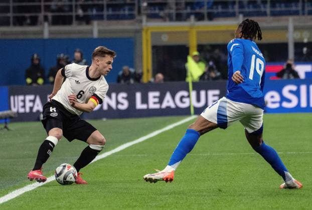 20 03 2025, xcmcx, Football UEFA Nations League, Italy Germany v l Joshua Kimmich German National Football Team DFB , Destiny Udogie Italy DFL DFB REGULATIONS PROHIBIT ANY USE OF PHOTOGRAPHS as IMAGE SEQUENCES and or QUASI VIDEO Milan