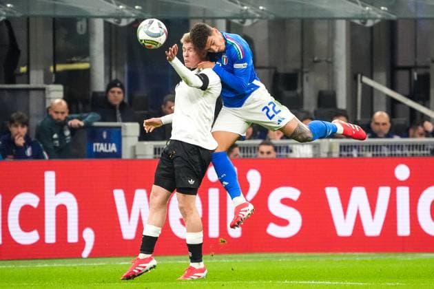 Jonathan Burkhardt Germany Germany, 7 and Giovanni Lorenzo Italy, Italia, 22 collide with their heads in a duel Milan 20 03 2025 Italy vs Germany, Nations League quarter-final first leg, San Siro