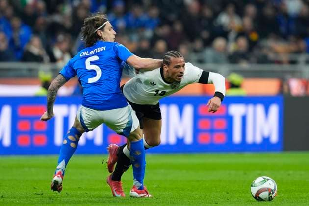 Riccardo Calafiori (Italy) and Leroy Sane (Germany) battle for the ball, UEFA Nations League Quarterfinal First leg, Italy and Germany, San Siro Stadium, March 20, 2025, Milan, Italy.