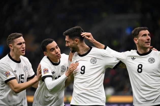 Tim Kleindienst of Germany celebrates with Leon Goretzka, Jamal Musiala and Nico Schlotterbeck after scoring the goal of 1-1 during the UEFA Nations League football match between Italy and Germany at San Siro stadium in Milano (Italy), March 20, 2025. AndreaxStaccioli