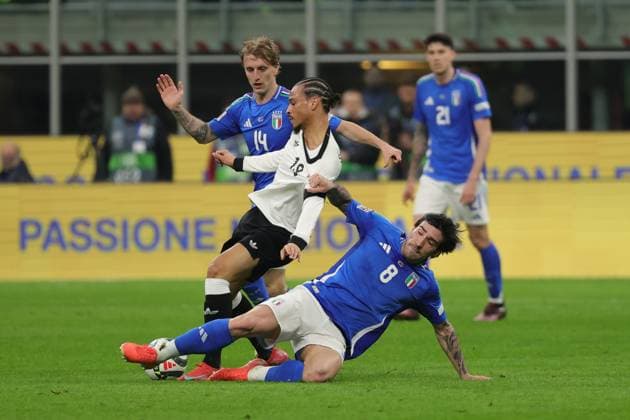 20th March 2025; Stadio San Siro, Milan, Italy, UEFA Nations League Football, Quarter Finals, First Leg, Italy versus Germany; Leroy Sane of Germany under pressure from Sandro Tonali of Italy  ActionPlus12763494 EmanuelexPennacchio