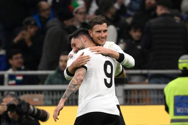 Leon Goretzka of Germany celebrates with Tim Kleindienst after scoring the goal of 1-2 during the UEFA Nations League football match between Italy and Germany at San Siro stadium in Milano (Italy), March 20, 2025. AndreaxStaccioli