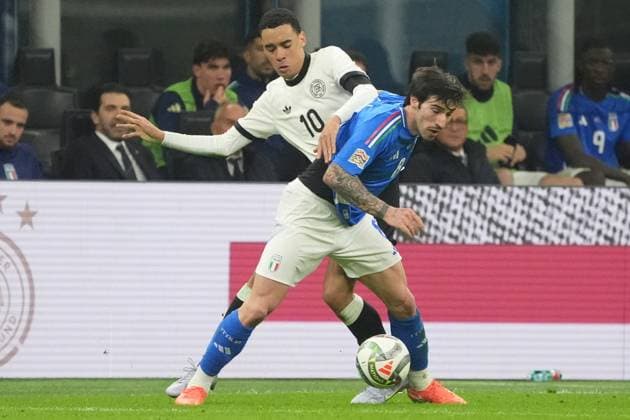 Jamal Musiala Germany, Germany, 10 in duel with Sandro Tonali Italy, Italy, Italia, 08 Milan 20 03 2025 Italy vs Germany, Nations League quarter-final first leg, San Siro