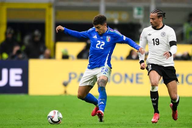Italy v Germany - UEFA Nations League Giovanni di Lorenzo of Italy competes for the ball with Leroy Sane of Germany during the UEFA Nations League quarterfinal first leg football match between Italy and Germany. Milan Italy Copyright: xNicolòxCampox