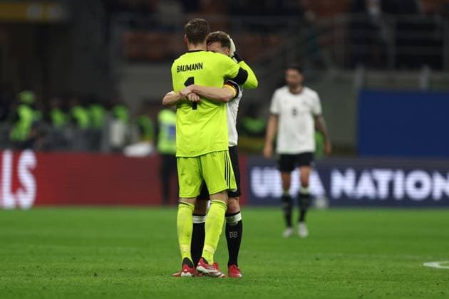 Italy vs Germany Oliver Baumann of Germany and Joshua Kimmich of Germany celebrate at the end of the UEFA Nations League quarter-final first leg match between Italy and Germany at Stadio San Siro on March 20, 2025 in Milan, Italy. Milano Stadio Giuseppe Meazza Italy Copyright: xMarcoxCanonierox