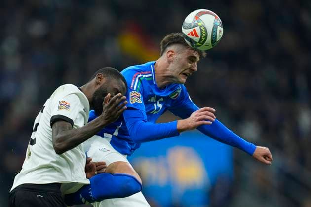 Antonio Rudiger (Germany) and Lorenzo Lucca (Italy) battle for the ball, UEFA Nations League Quarterfinal First leg, Italy and Germany, San Siro Stadium, March 20, 2025, Milan, Italy.