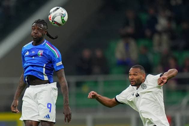 Italy s Moise Kean fights for the ball with Germany s Jonathan Burkardt during the Uefa Nations League soccer match between Italy and Germany at the San Siro Stadium in Milan, north Italy - Thursday , Mach 20 , 2025 . - Soccer .  Copyright: xSpada LaPressex
