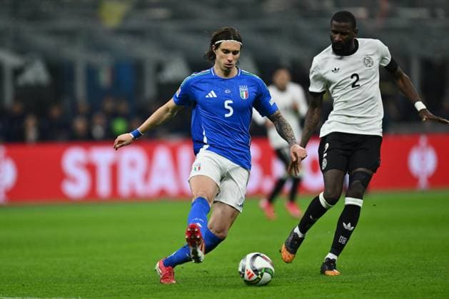 Riccardo Calafiori (ITA) and Antonio Rudiger (GER) are in action during the UEFA Nations League quarter-final match between Italy and Germany at the San Siro Stadium on March 20, 2025 in Milan, Italy.  Copyright: xDomenicoxCippitelli IPAxSportx xipa-agency.netx xx IPA_55558414 IPA_Agency_IPA55558414