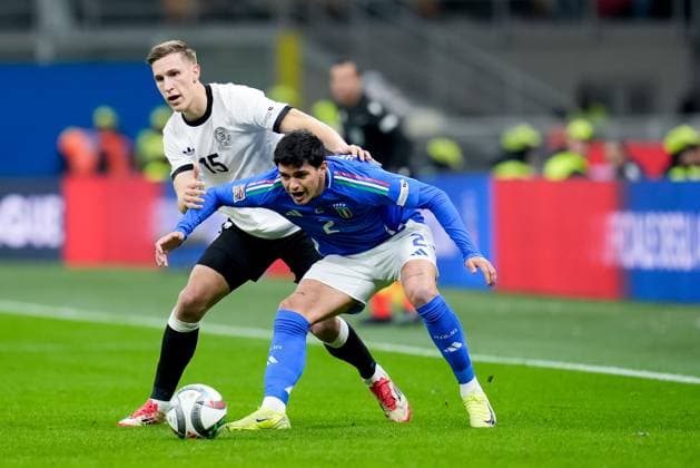 Italy v Germany - UEFA Nations League Quarterfinal Leg One Raoul Bellanova of Italy and Nico Schlotterbeck of Germany compete for the ball during the UEFA Nations League Quarter Final Leg One match between Italy and Germany at Stadio Giuseppe Meazza on March 20, 2025 in Milan, Italy. Milan Stadio Giuseppe Meazza Milan Italy Copyright: xGiuseppexMaffiax NationsLeague_Italy-Germany_200325_BRU1271