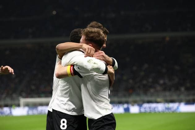 March 20, 2025, Milan, Lombardy, Italy: LEON GORETZKA 8 of Germany celebrates with his teammates and notably the assist by JOSHUA KIMMICH 6 in the UEFA Nations League 2024 quarterfinal first leg between ITALY and GERMANY at San Siro Stadium in Milan, Italy Milan Italy - ZUMAc179 20250320_zep_c179_098 Copyright: xMickaelxChavetx