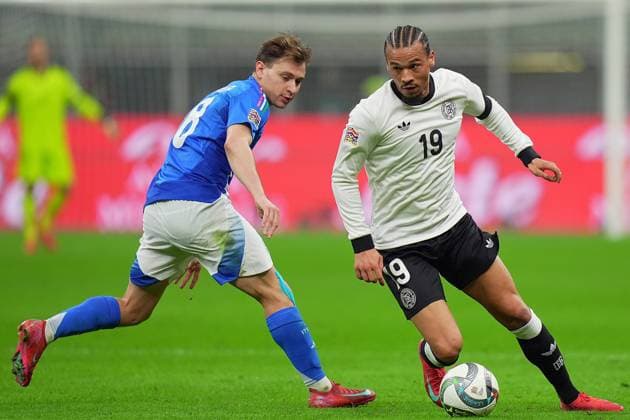 Italy s Nicolo Barella fights for the ball with Germany s Leroy Sane during the Uefa Nations League soccer match between Italy and Germany at the San Siro Stadium in Milan, north Italy - Thursday , Mach 20 , 2025 . - Soccer .  Copyright: xSpada LaPressex