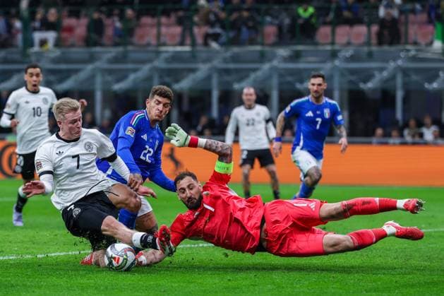 CALCIO - UEFA Nations League - Quarter Finals - Italy vs Germany Gianluigi Donnarumma of Italy seen in action with Jonathan Burkardt of Germany during UEFA Nations League 2024 25 Quarter-Finals football match between Italy and Germany at San Siro Stadium Milan Italy  Copyright: xIPAxSport ABACAx