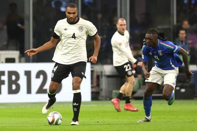 CALCIO - UEFA Nations League - Quarter Finals - Italy vs Germany Milan, Italy 20.03.2025: Jonathan Tah of Germany, Destiny Udogie of Italy seen in action during the Uefa Nations League 2025, quarter finals, football match between Italy vs Germany at Giuseppe Meazza stadium in Milan. Milan Italy  Copyright: xIPAxSport ABACAx