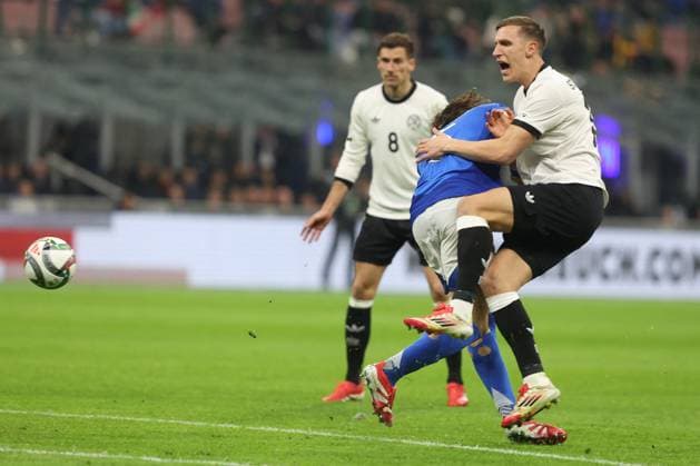 CALCIO - UEFA Nations League - Quarter Finals - Italy vs Germany Milan, Italy 20.03.2025: Riccardo Colafiori of Italy , Nico Schlotterbeck of Germany seen in action during the Uefa Nations League 2025, quarter finals, football match between Italy vs Germany at Giuseppe Meazza stadium in Milan. Milan Italy  Copyright: xIPAxSport ABACAx