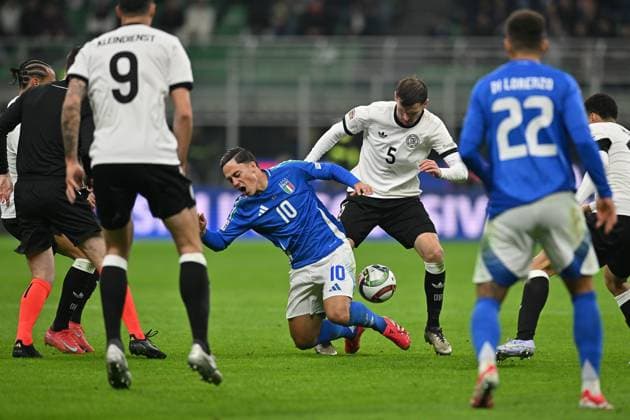 20th March 2025; Stadio San Siro, Milan, Italy, UEFA Nations League Football, Quarter Finals, First Leg, Italy versus Germany; Giacomo Raspadori of Italy under pressure from Pascal Gross of Germany  ActionPlus12763609 AllShotLive