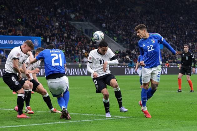 Milan, Italy, 20th March 2025. David Raum of Germany heads on from Jamal Musiala of Germany as Alessandro Bastoni of Italy clashes with Joshua Kimmich of Germany during the UEFA Nations League match at Giuseppe Meazza, Milan. Picture credit should read: Jonathan Moscrop Sportimage EDITORIAL USE ONLY. No use with unauthorised audio, video, data, fixture lists, club league logos or live services. Online in-match use limited to 120 images, no video emulation. No use in betting, games or single club league player publications. SPI_073_JM_ITALY_GERMANY_UNL_ SPI-3749-0073