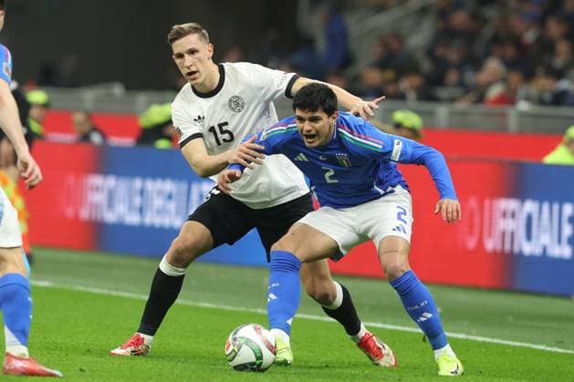 CALCIO - UEFA Nations League - Quarter Finals - Italy vs Germany Milan, Italy 20.03.2025: Nico Schlotterbeck of Germany, Raoul Bellanova of Italy seen in action during the Uefa Nations League 2025, quarter finals, football match between Italy vs Germany at Giuseppe Meazza stadium in Milan. Milan Italy  Copyright: xIPAxSport ABACAx