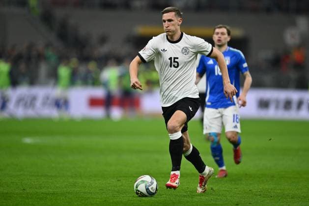 CALCIO - UEFA Nations League - Quarter Finals - Italy vs Germany Nico Schlotterbeck (GER) is in action during the UEFA Nations League quarter-final match between Italy and Germany at the San Siro Stadium on March 20, 2025 in Milan, Italy. Milan Italy  Copyright: xIPAxSport ABACAx