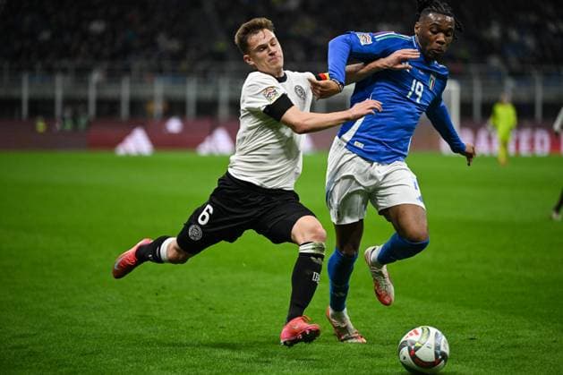 CALCIO - UEFA Nations League - Quarter Finals - Italy vs Germany Joshua Kimmich of Germany and Destiny Udogie of Italy during the UEFA NATIONS LEAGUE 2025 match between Italy and Germany, round of quarter finals first leg match, on 20 of March 2025 at Giuseppe Meazza San Siro Siro stadium in Milan, Italy. Photo Tiziano Ballabio Milan Italy  Copyright: xIPAxSport ABACAx