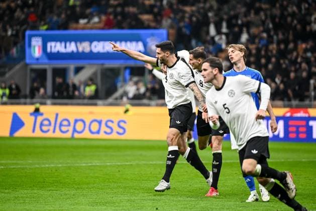 Tim Kleindienst Germany , Leon Goretzka Germany and Pascal Gross Germany celebrates after scoring his team s first goal with teammates during the UEFA Nations League quarterfinal leg one match between Italy and Germany at Stadio San Siro on March 20, 2025 in Milan, Italy Photo by Harry Langer DeFodi Images